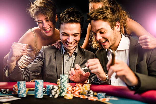 Dealer hand dealing cards from the shoe during a live baccarat session